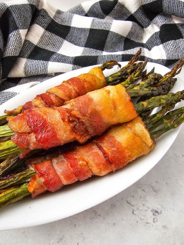 Bacon Wrapped Asparagus on a white plate