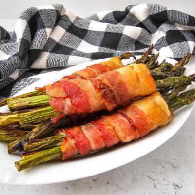 Bacon Wrapped Asparagus on a white plate