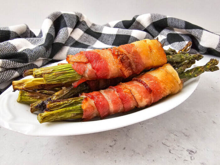 Bacon Wrapped Asparagus on a white plate