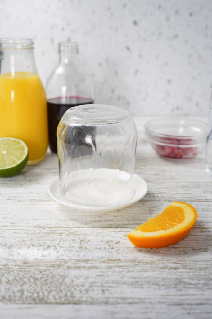 adding sugar to the rim of the glass
