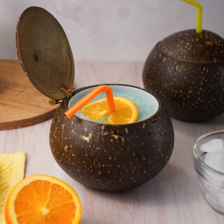 Frozen Blue Cocktails with Vodka in a coconut cup