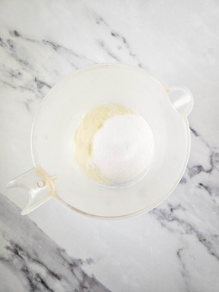 adding the ingredients into the measuring cup