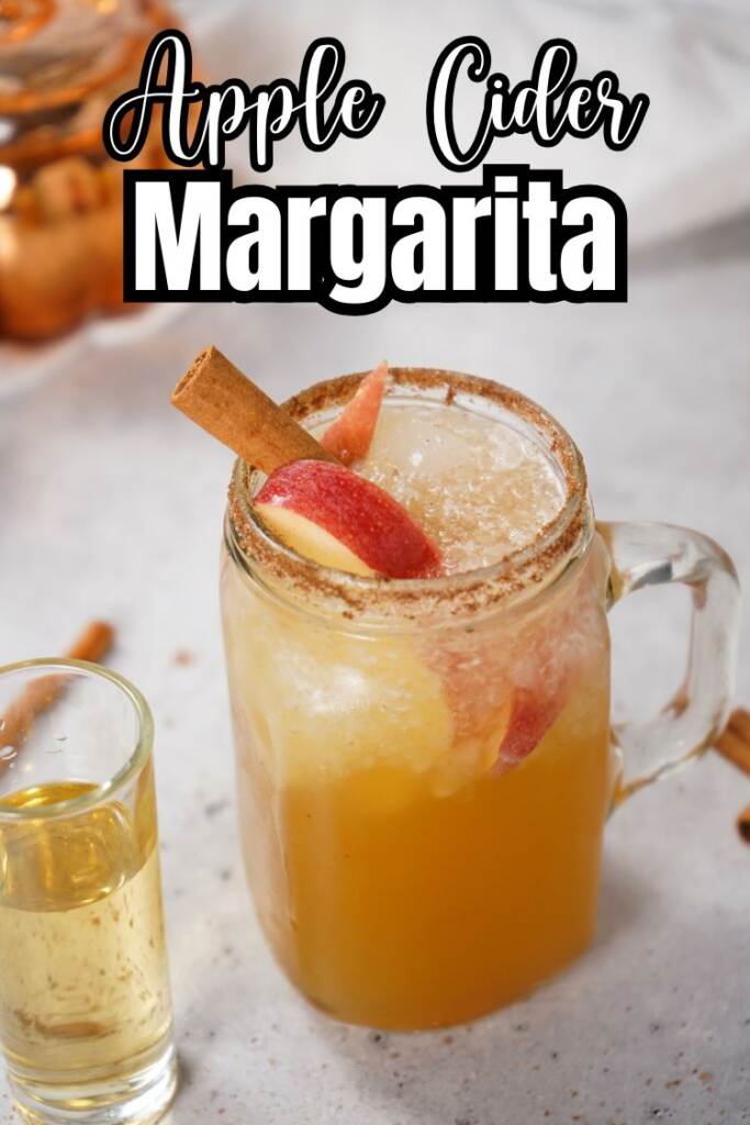 Apple Cider Margarita in mason jar glass garnished with cinnamon stick and apple slice