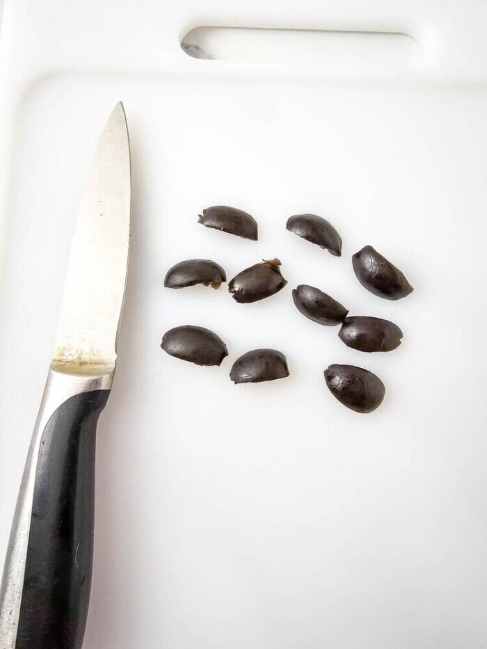 Sliced black olives prepared for Easter Chick Deviled Eggs eyes.