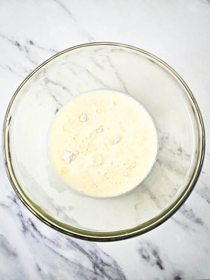 Milk and pudding mixture in a bowl for Easter Peeps Dirt Cups.