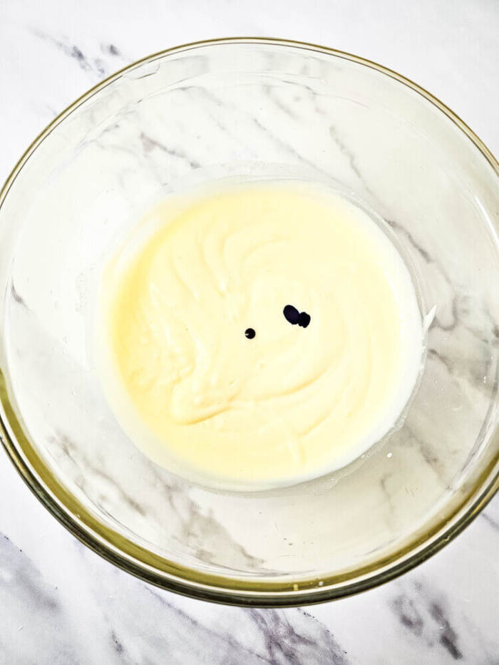 Food coloring added to pudding for Easter Peeps Dirt Cups.