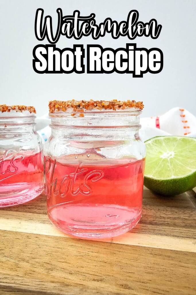 Text: watermelon shot recipe - pink shots on wood board with tajin rim