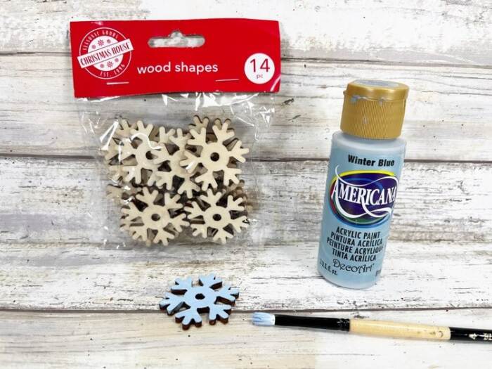 painting wooden snowflake embellishment for rope snowman craft