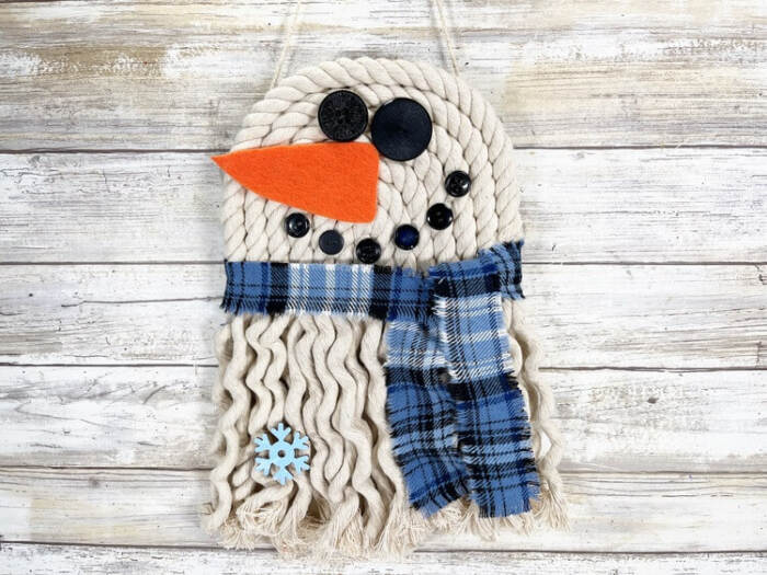 snowman rope wall hanging with blue plaid scarf and button face