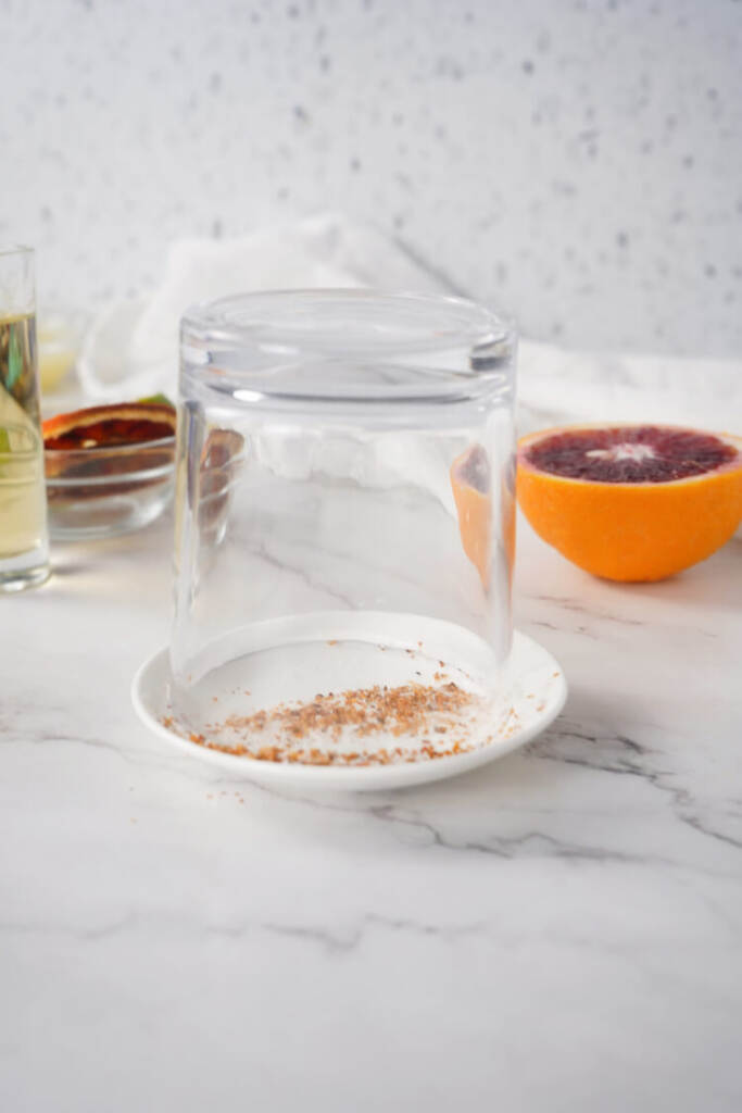 adding the tajin and salt to the rim of the glass