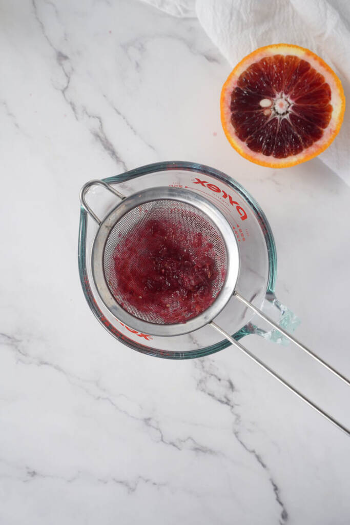 juice in a glass mixing cup