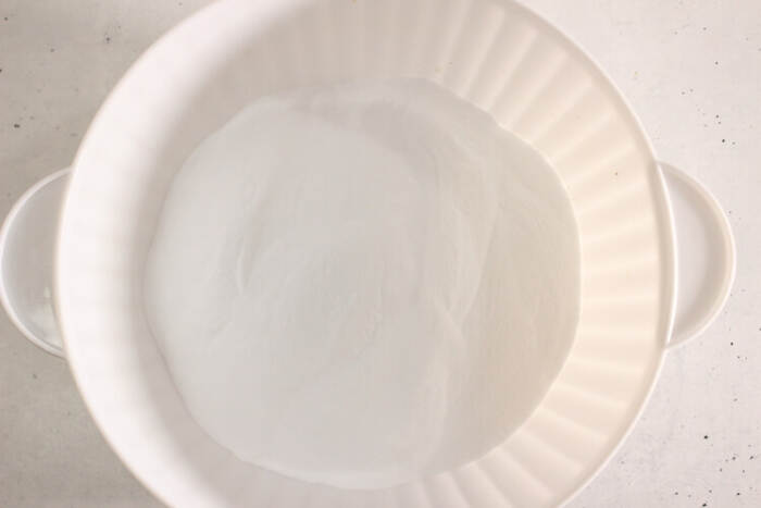 Baking soda and SLSa powder mixed in a large white bowl