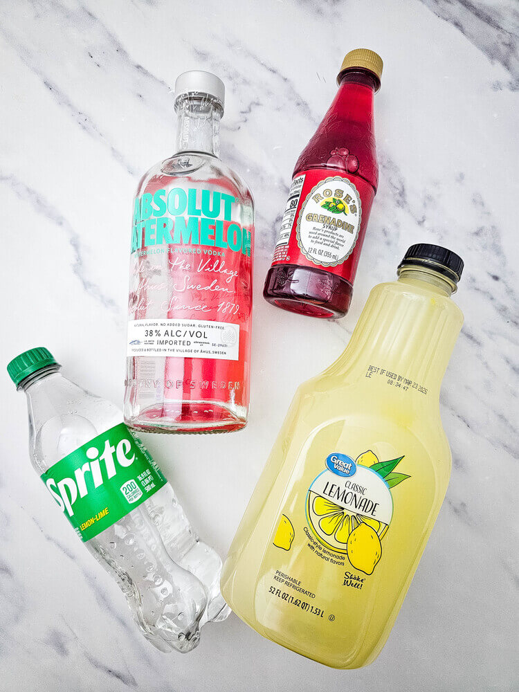 Overhead view of bottled ingredients of watermelon Jolly rancher drink.