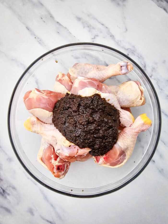 Chicken and seasoning in a bowl jerk chicken drumsticks recipe.