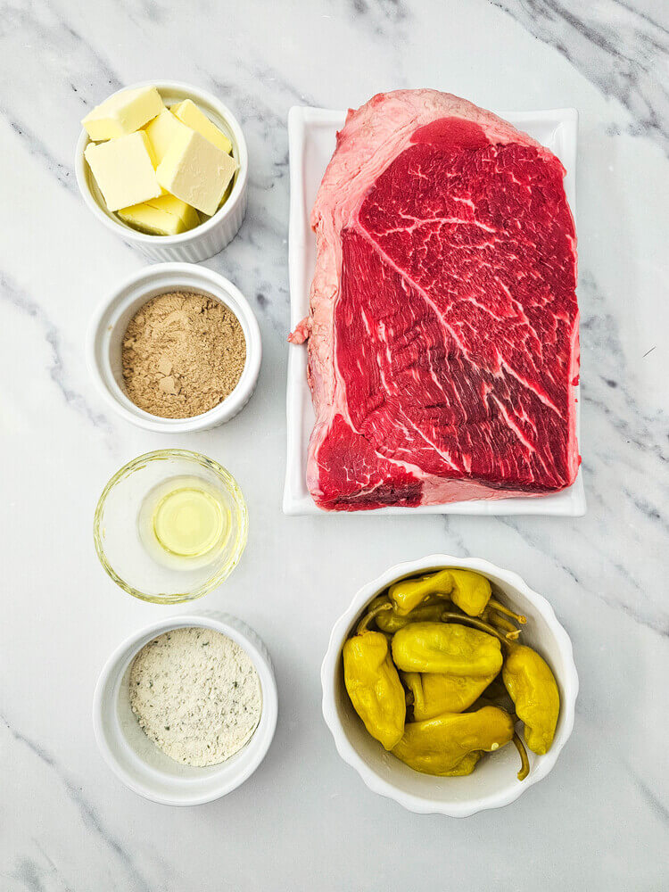 Overhead view of dutch oven mississippi pot roast ingredients.