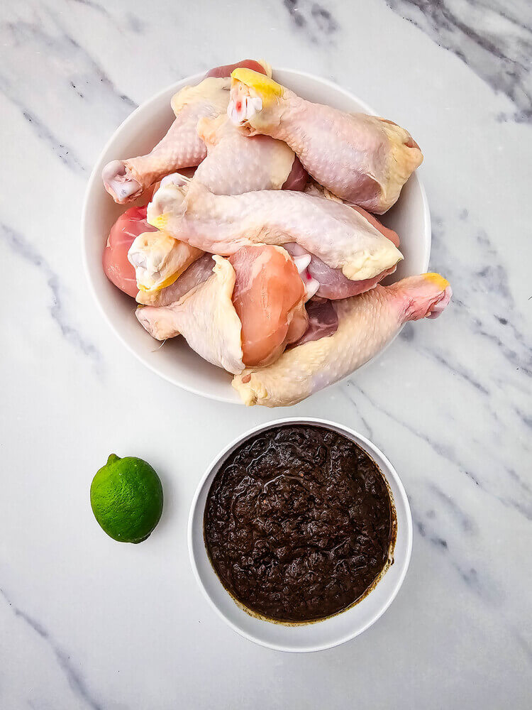 Overhead view of jerk chicken drumsticks recipe ingredients.