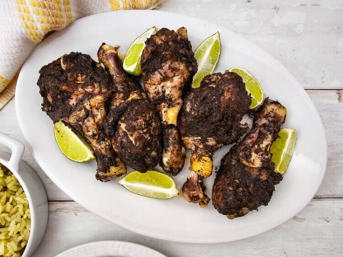 Jerk chicken drumsticks recipe on a plate.